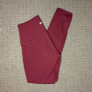 Size 6, lululemon leggings, i between a burnt orange and pink.